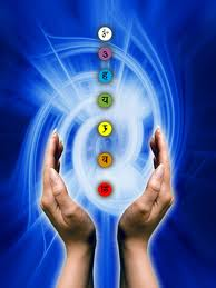distance healing hands with blue background and chakras