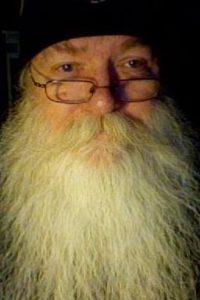 Old man with glasses has white beard wizard